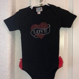 “Love” onesie with red ruffles on the butt